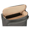 A grey wheeled duffle bag with an open top revealing a tan interior and a black item inside. It has a logo.