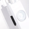 A white safety alarm keychain with a circular button and a small black switch. It has a branding logo.