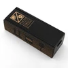 A black box with a textured design and a logo, featuring warning labels and a handle.