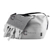 A cooler bag in grey with a black strap, alongside a matching grey towel featuring tassels and a logo.