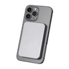 A silver power bank attaches magnetically to the back of a grey smartphone, featuring a sleek design.