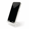 A clear acrylic phone stand displaying a smartphone in an upright position.