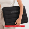 A black neoprene laptop sleeve, featuring a padded design and a logo, held by a person. More colours available.