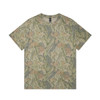 A heavy faded camo tee featuring a mix of green and tan camouflage patterns, with a logo on the label.