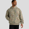 A faded camo hoodie in shades of green and brown, featuring a front pocket and a hood. It has a logo on it.