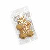 A gingerbread man cookie in a clear plastic package, decorated with white icing and a festive design.
