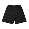 Black shorts with an elastic waistband, featuring a simple design and no visible logos. Suitable for casual wear.