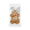 A gingerbread man cookie in a clear wrapper, featuring white icing decorations and a festive 'Merry Christmas' message.