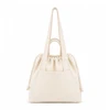 A cream tote bag with long straps, a drawstring closure, and a front pocket, featuring a logo.