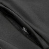 A close-up of a black softshell jacket featuring a zippered pocket and sleek fabric texture.