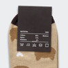 A pair of beige ankle socks featuring a playful animal pattern, with a dark brown heel and toe. Includes a product label.