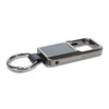 A silver Bluetooth tracker with a keyring attachment, featuring a rectangular shape and a sleek design.