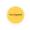 A round container with a bright yellow lid featuring a black and red logo.