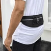 A black recycled running waist pack with a textured finish, featuring drawstrings and a logo, worn at the waist.