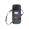 A navy blue travel pouch with multiple compartments, holding a phone, cards, and a passport. Features a logo.