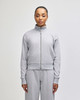 A grey full-zip jacket with a stand collar, featuring a fitted design and long sleeves. Contains a logo.