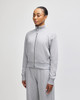 A grey women's full-zip jacket in French terry fabric, featuring a high collar and relaxed fit.