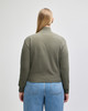 A women's full-zip jacket in olive green, featuring a solid design and a logo on the back.