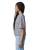A grey mid-length boxy top with short sleeves, featuring a side view of a model with long braids.