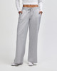 Wide leg pants in light grey, featuring an elastic waist and side pockets. The model wears a fitted top.
