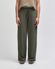 Wide leg pants in olive green with a drawstring waistband, featuring a relaxed fit and a logo on the waistband.