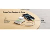 A slim white power bank with a magnetic design and a smartphone is shown on a wooden surface.