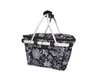 A black and white floral insulated carry basket with a lid and silver handles. It has a branded logo.