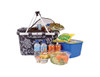 A floral-patterned insulated carry basket with a lid, filled with food, drinks, and a blue storage container.