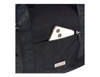 A black cooler bag with a smartphone tucked into a front pocket and a subtle logo visible on the straps.