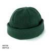 A green polar fleece beanie with a fold-up cuff and a circular top, featuring a logo.