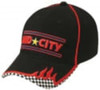 A black cap with red stitching, featuring flame designs and a checkered pattern along the brim. It has a logo.