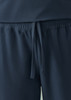 Navy women's jogger scrub pants with an elastic waistband and drawstring detail. Features smooth fabric and a logo.