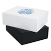 A magnetic gift box set in white and black, stacked one on top of the other, featuring a decorative design on the top.