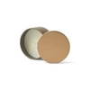 A mini tin candle in a gold-coloured tin, with a white wax interior and a visible wick.