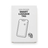 A white box containing a smart luggage tag, featuring a logo and a simple illustration of the tag design.