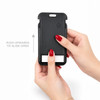 A black luggage tag tracker is being held, featuring a sliding mechanism and a logo on the front.