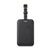 A black luggage tag tracker with a looped strap and a minimalist design, featuring a small logo on the front.