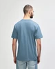A softstyle adult midweight t-shirt in blue with yellow side panels, featuring a logo on the back.
