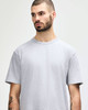 A grey midweight T-shirt with a relaxed fit, featuring a brand logo.