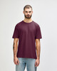 A maroon Gildan Softstyle adult t-shirt displayed on a male model against a neutral background. The shirt has a brand logo.