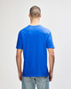 A blue Gildan Softstyle adult T-shirt viewed from the back, featuring a plain design and a tag.