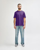A purple Gildan Softstyle adult t-shirt displayed on a mannequin paired with light blue jeans and white shoes.