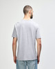 A grey Gildan Softstyle adult T-shirt displayed on a model, featuring a relaxed fit and short sleeves.