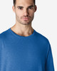 A blue Gildan Softstyle adult T-shirt displayed on a male model with a neutral expression.