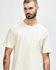 A white adult T-shirt featuring a relaxed fit, with a crew neckline and no visible logos.