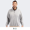 A full zip jacket in light grey worn by a male model, featuring a collar and elastic cuffs. It has a logo.