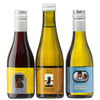 Three drink bottles: one red, two white, each with unique labels and various designs.