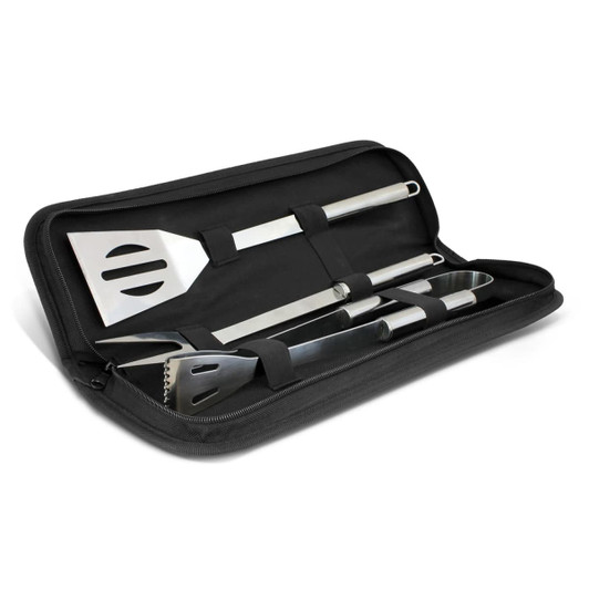 A BBQ toolset featuring stainless steel spatula, tongs, and fork, housed in a compact black case.