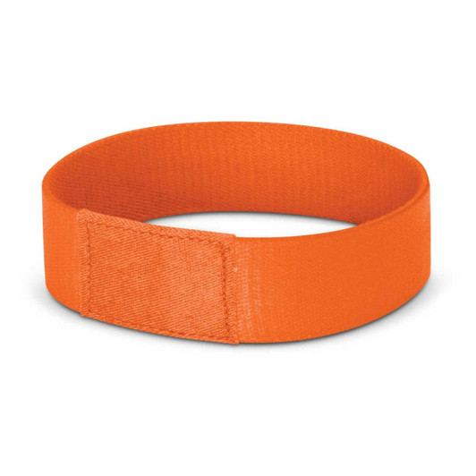 An orange wristband designed for events, featuring a secure fastening mechanism.