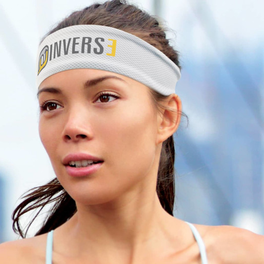 An Active Cooling Sweat Band in gray with a logo and the word "INVERSE" printed on it, worn by a woman.